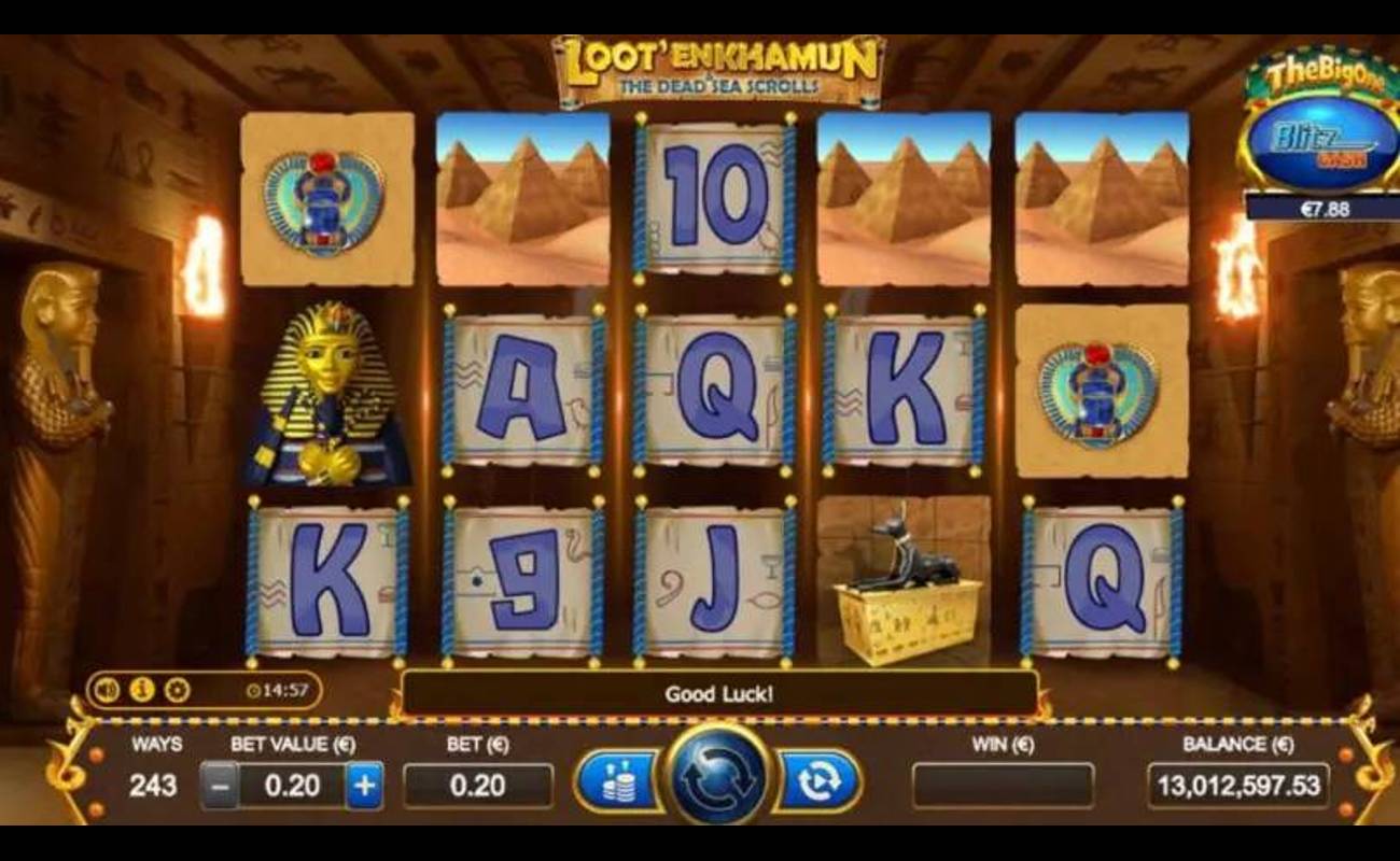 A screenshot of the slot reels in Loot’En Khamun and the Dead Sea Scrolls. The game is set inside a passageway in an Egyptian pyramid. The reels contain symbols like a sarcophagus, a scarab brooch, three pyramids, and a statue of Anubis, as well as card symbols like the A, K, Q, and J.