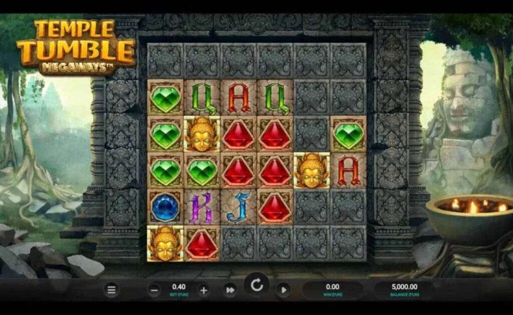 A screenshot of the reels in Temple Tumble Megaways. The game is set in ancient ruins in a jungle. The reels are set between the pillars of a stone temple wall and feature symbols, like red, green, and blue gems, as well as A, K, Q, and J standard slot symbols.