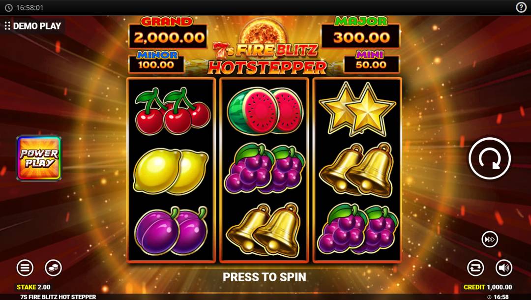 The slot reels in 7s Fire Blitz Hotstepper. In the background is a pulsating orange ring of energy with beams of light rotating around it. In the foreground are the slot reels with various fruit-themed symbols, including cherries, lemons, plums, grapes, watermelons, stars, and bells. Above the reels are the four jackpot prizes, to the left of the reels is the Power Play toggle, and to their right is the game interface.