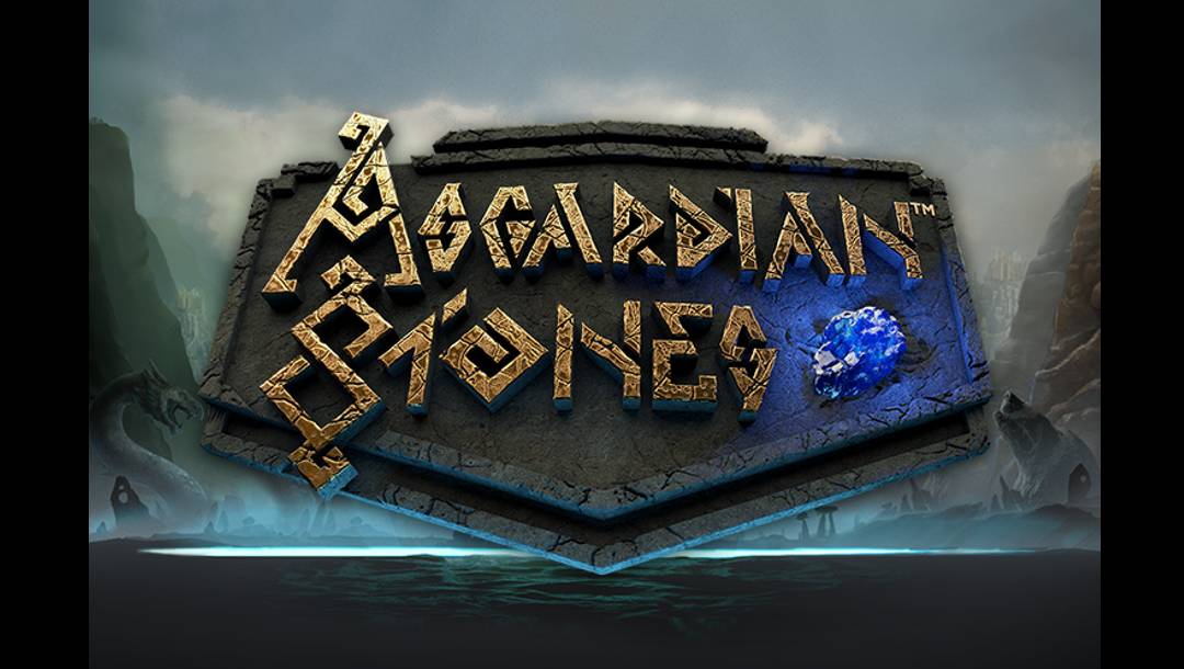 The title screen for Asgardian Stones. The background shows a misty lake between two mountains with a cloudy sky overhead. Light appears to shine from the lake. In the foreground is the game title set against stone.