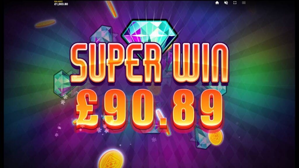 A screenshot of a Super Win in Diamond Blitz. The background features various colored beams of light. In the foreground are gems and coins with the words “Super Win” and a payout value in front of them.