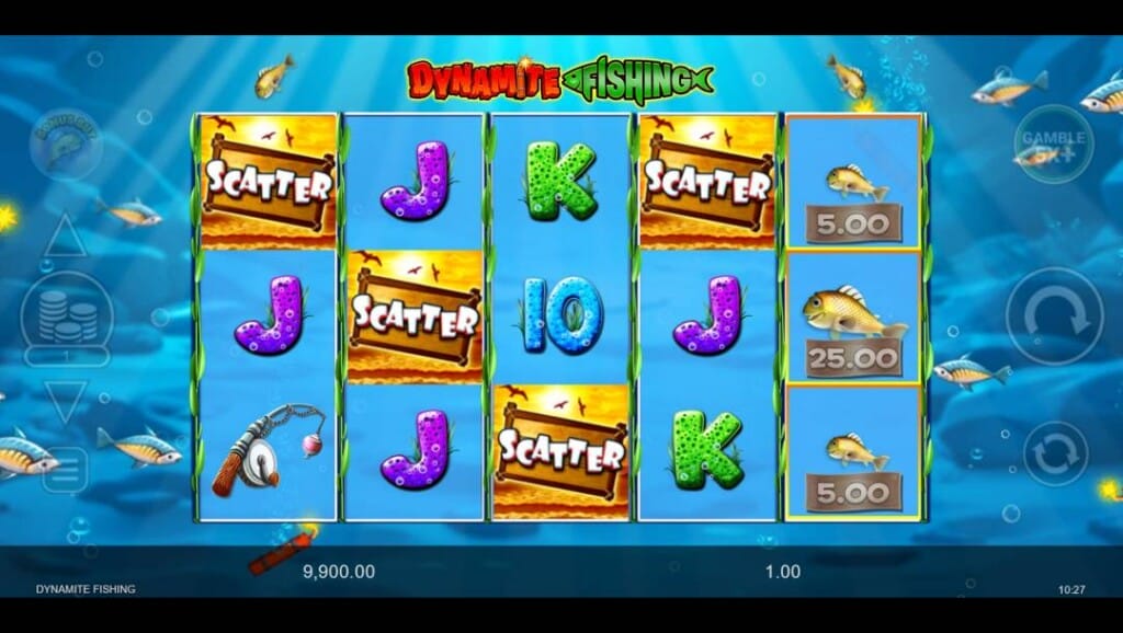 A screenshot of the slot reels in Dynamite Fishing. The background is an out-of-focus view of a scene underwater with light shining down on rocks on the ocean floor. In the foreground are the slot reels with fishing- and playing-card-themed slot symbols. There are fish swimming around the slot reels.