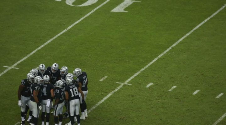 NFL football team huddle