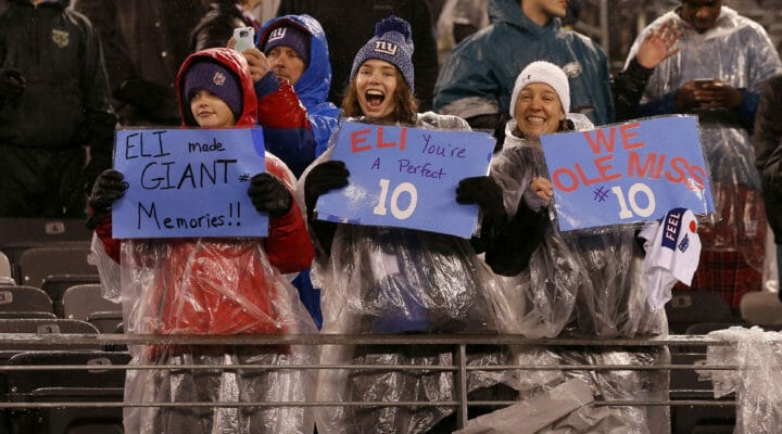 Young fans hold up signs for Eli Manning of the New York Giants in a game against the Philadelphia Eagles
