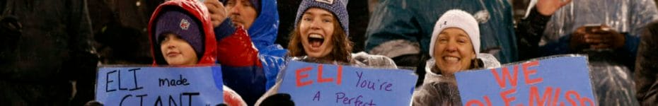 Young fans hold up signs for Eli Manning of the New York Giants in a game against the Philadelphia Eagles