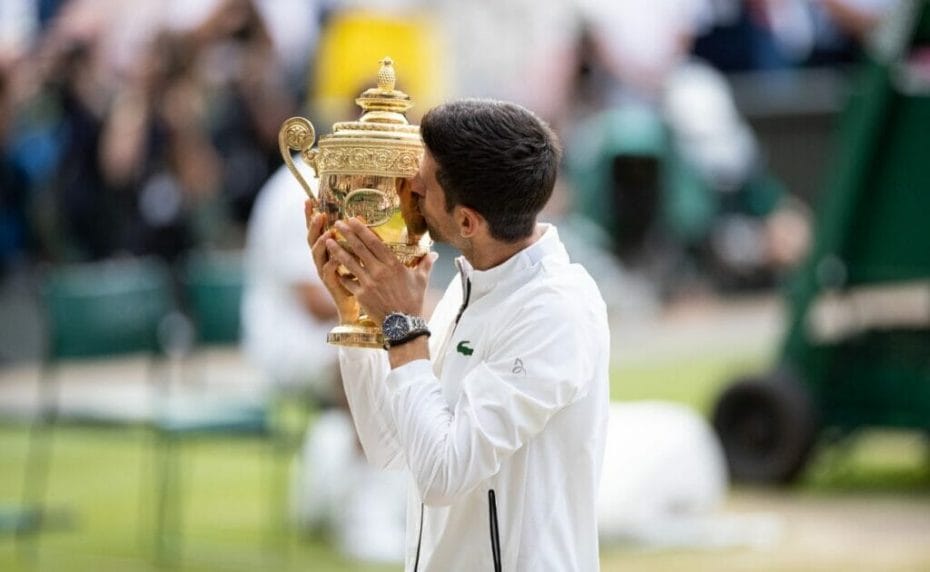 Novak Djokovic holding the Wimbledon Championship Trophy at Wimbledon July 2019