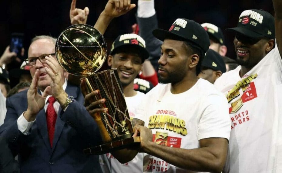 Kawhi Leonard of Toronto Raptors celebrates with the Larry O'Brien Championship Trophy at NBA Finals June 2019