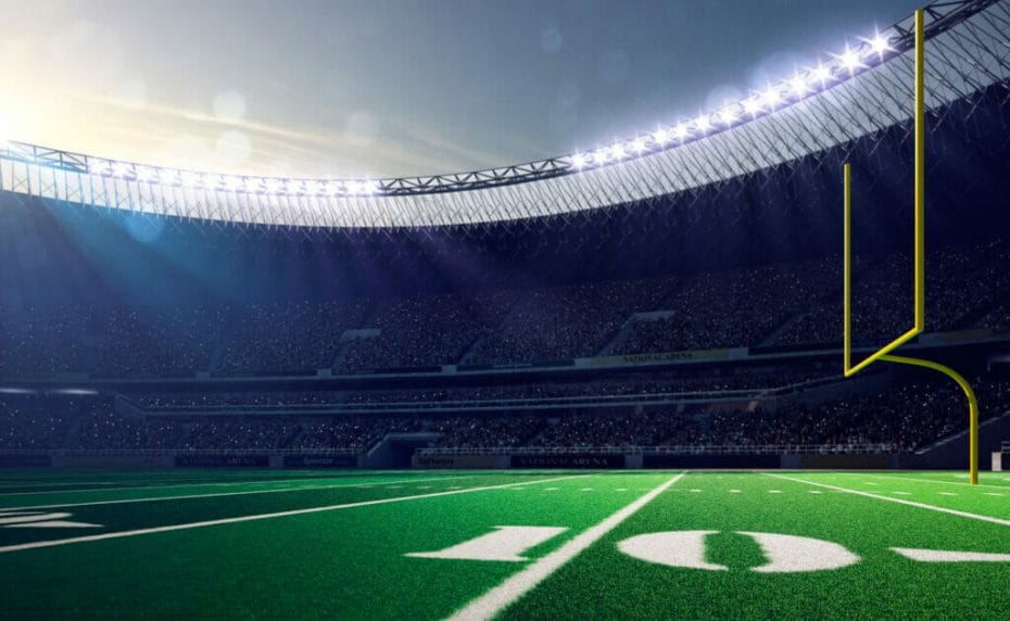 3D image of an American football pitch with posts and the sun shining onto the field.