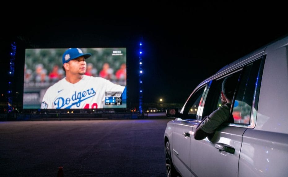 Dodgers fans watching the Los Angeles Dodgers vs. Tampa Bay Rays World Series on screen from their vehicle October, 2020 in Los Angeles, California. Photo by Brandon Bell/Getty Images