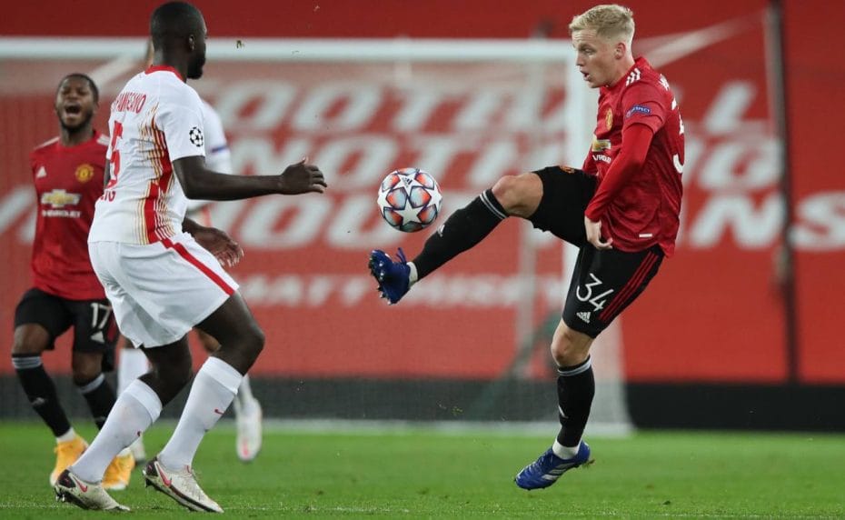 Donny Van De Beek of Manchester United challenged by Dayot Upamecano of RB Leipzig during the UEFA Champions League at Old Trafford October 2020. Photo by Clive Brunskill/Getty Images