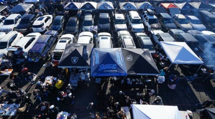 Oakland Raiders fans tailgate outside a stadium. Photo by Daniel Shirey/Getty Images.