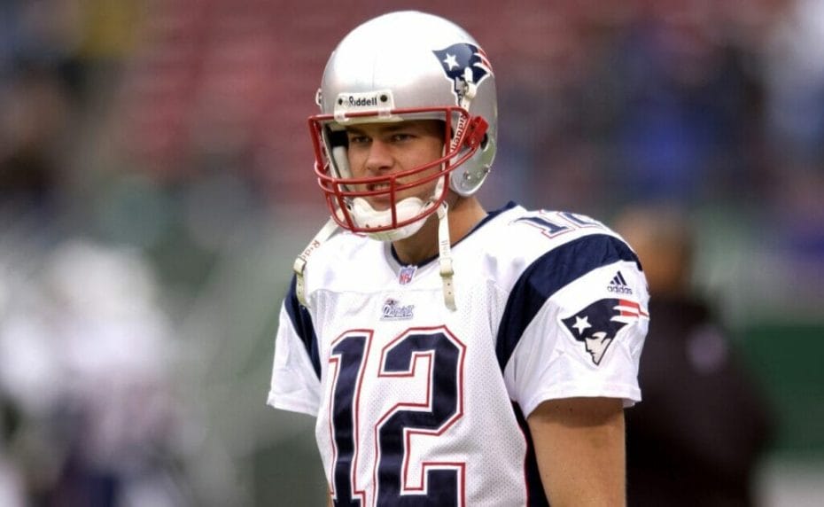 A young Tom Brady in his Patriots gear before the start of a game. Photo by Mitchell Reibel/Getty Images