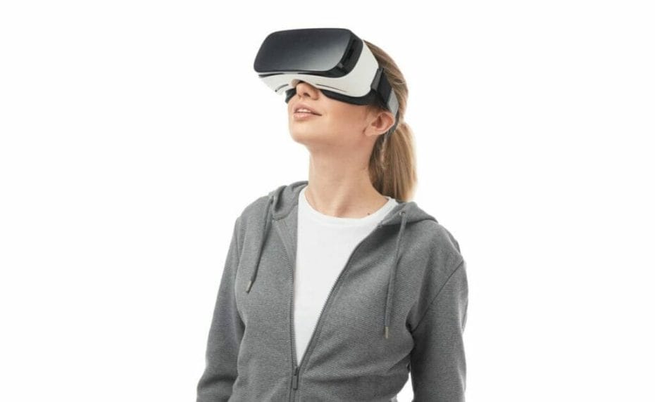 A woman wears a VR headset.