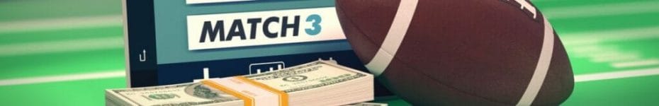 An American football and a stack of money on top of a laptop computer with match results.