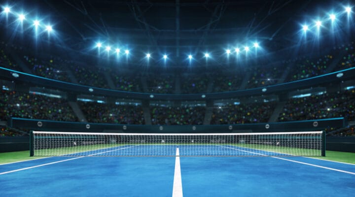 A tennis net across a blue court.