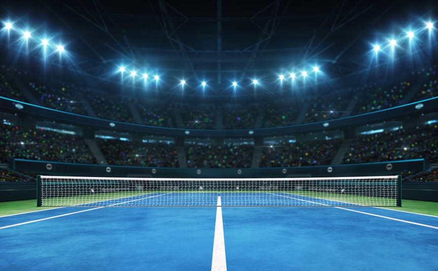A tennis net across a blue court.