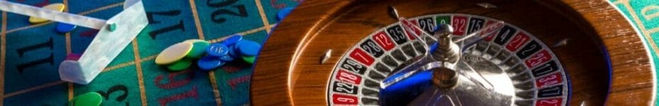 A roulette wheel on a green felt table.