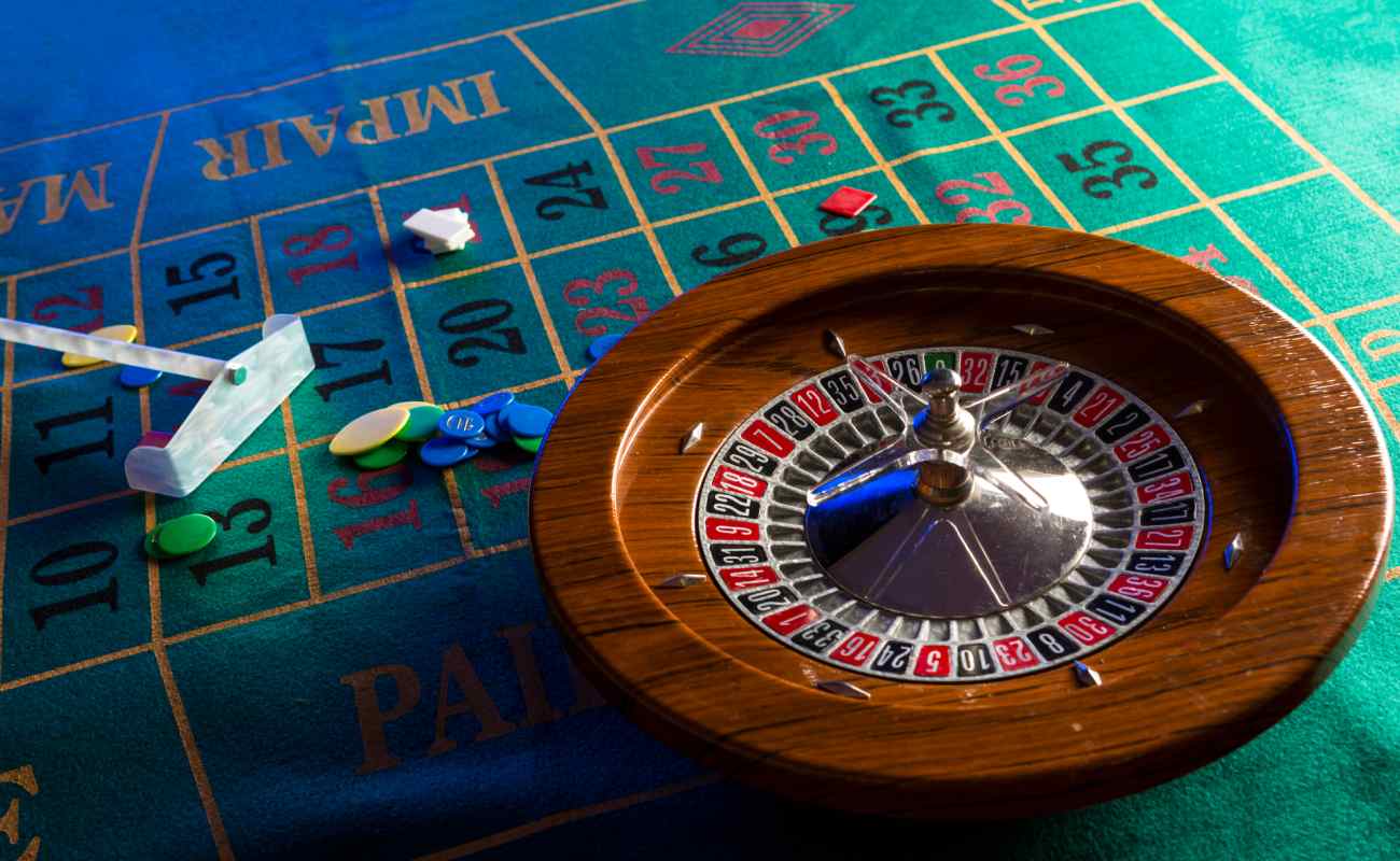 A roulette wheel on a green felt table.