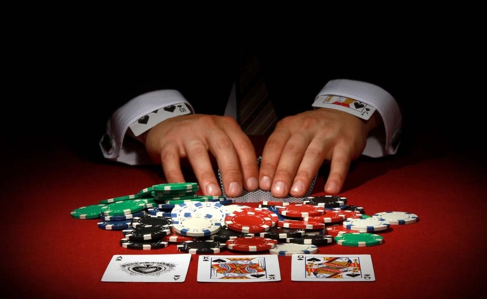 Casino player cheats while playing cards.