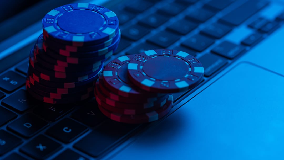 Two stacks of chips on a keyboard with a blue light filter