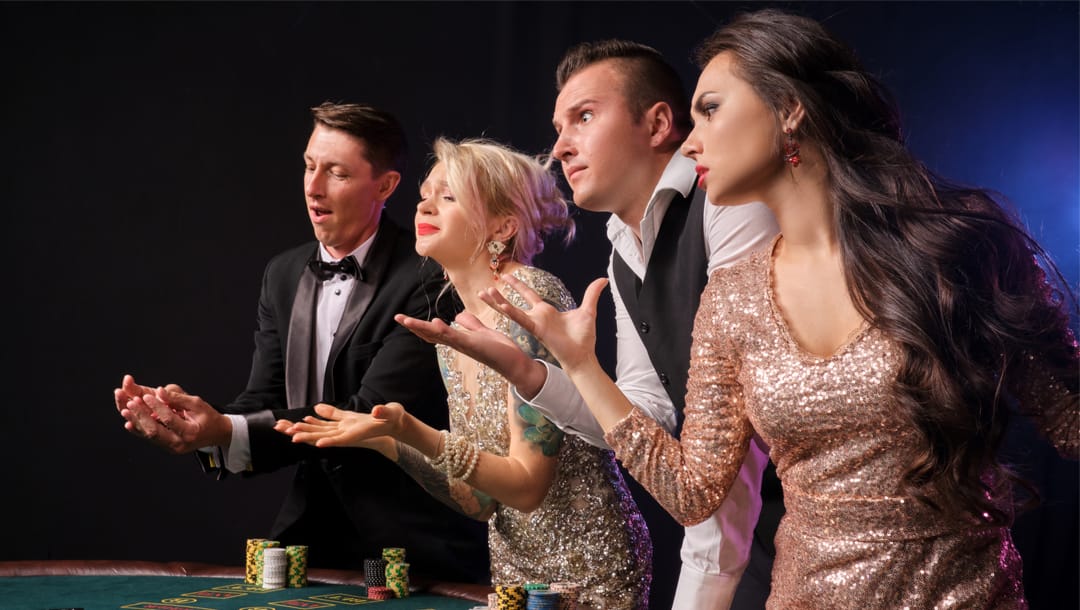A well-dressed group of players gesturing angrily across a poker table.