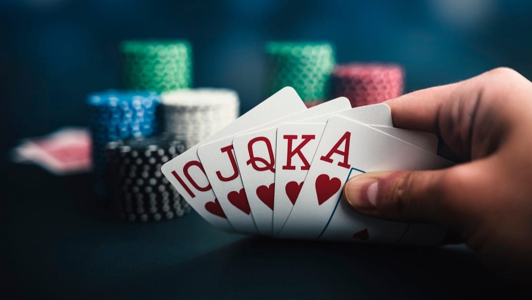 A poker player with a royal flush.