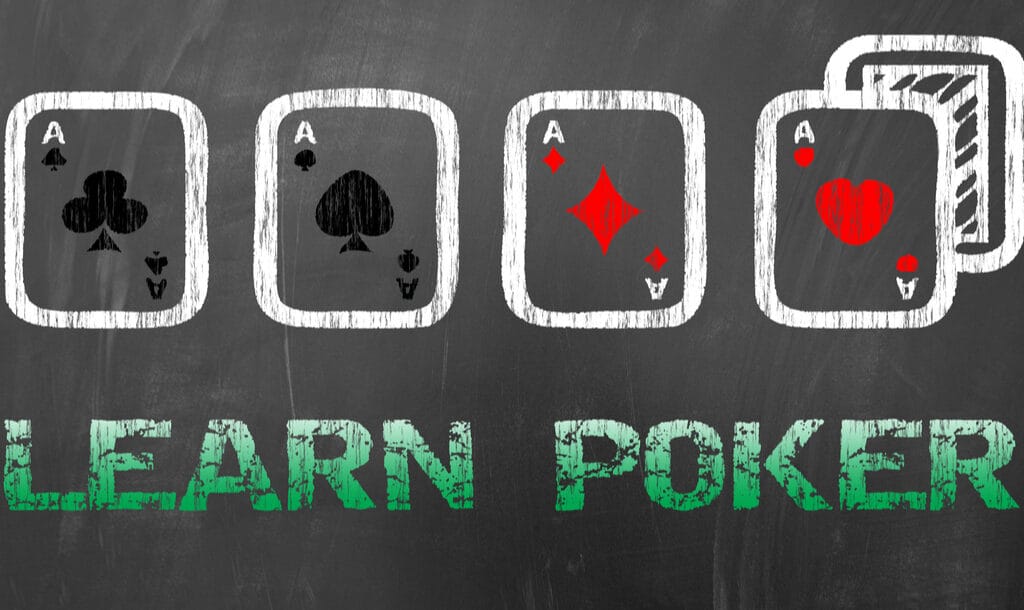 The words ‘learn poker’ and playing cards, drawn on a chalkboard.