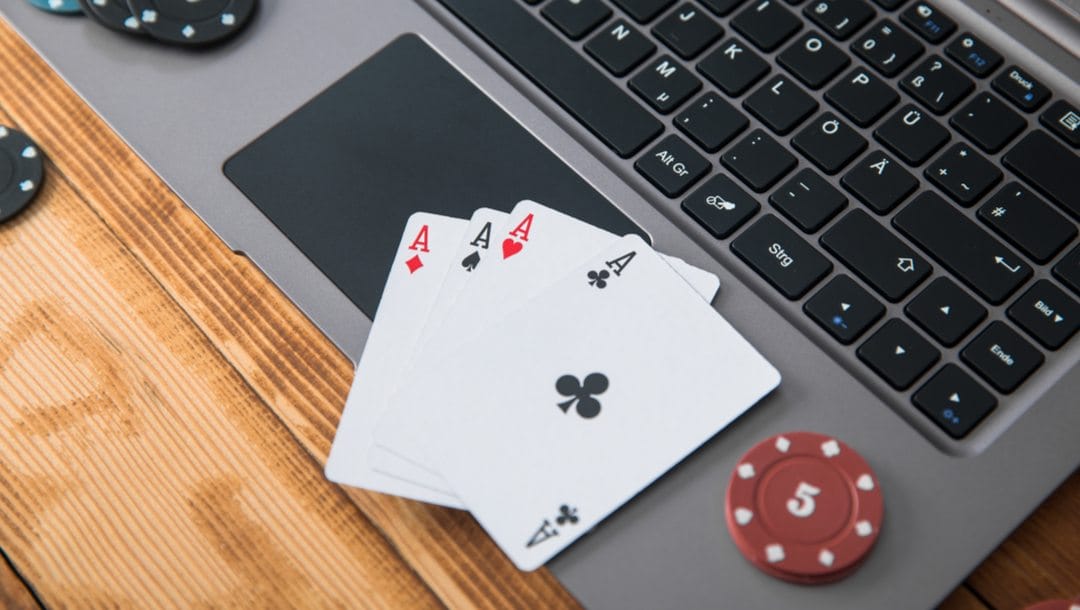 Header-Four-aces-and-some-poker-chips-sit-on-a-laptop-Online-poker-tournaments-you-can-play.jpg?strip\u003dall\u0026lossy\u003d1\u0026ssl\u003d1