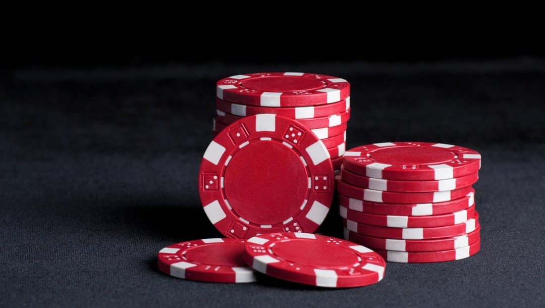 Two small stacks of red poker chips.