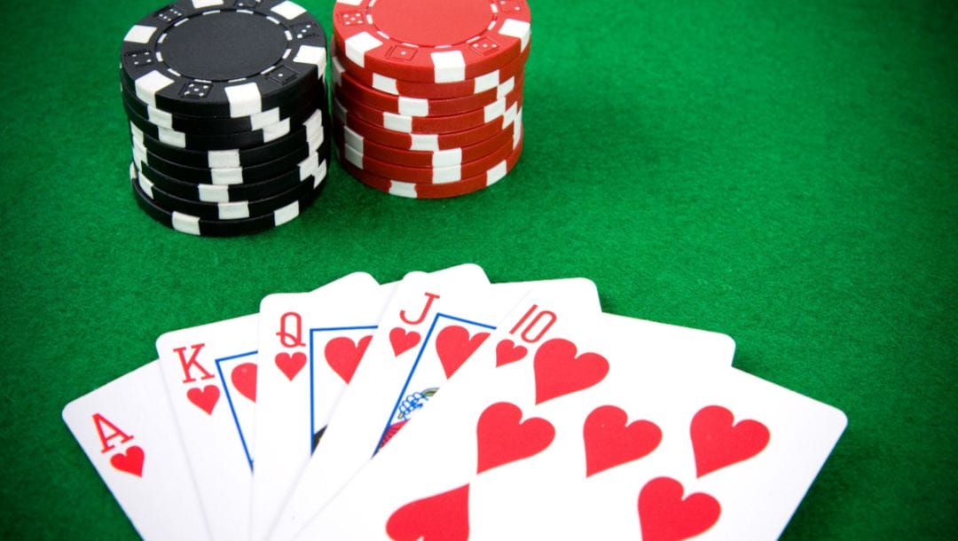 Poker arrangement with cards and poker chips.