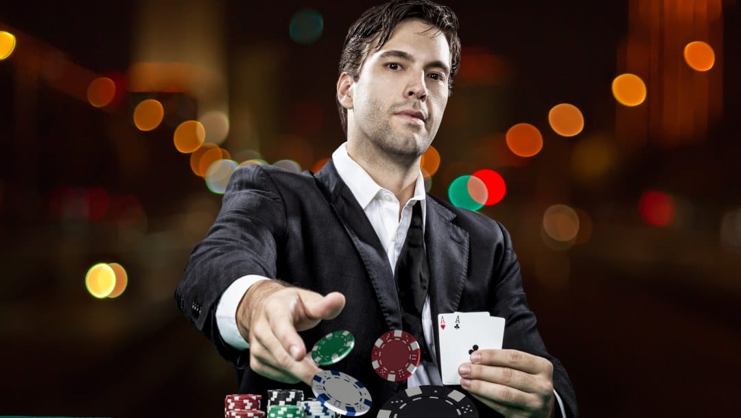 Poker player shows cards and throws poker chips.
