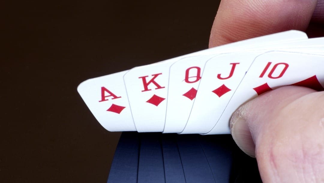 Playing cards against a black background.