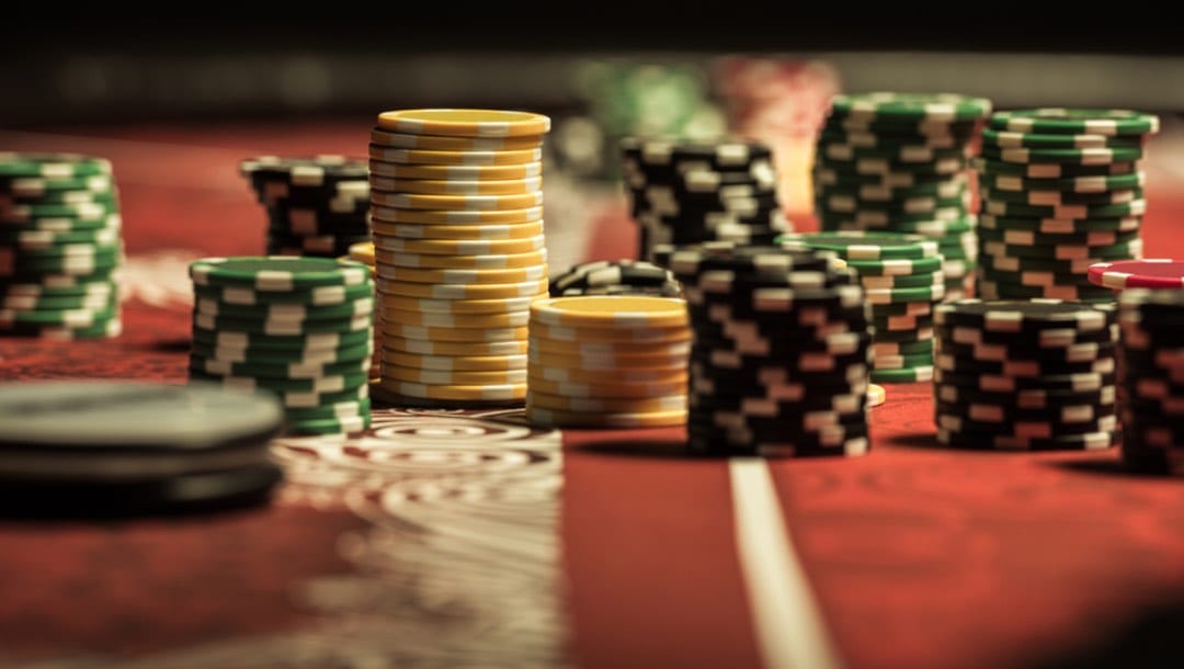 Several different stacks of poker chips on a table.