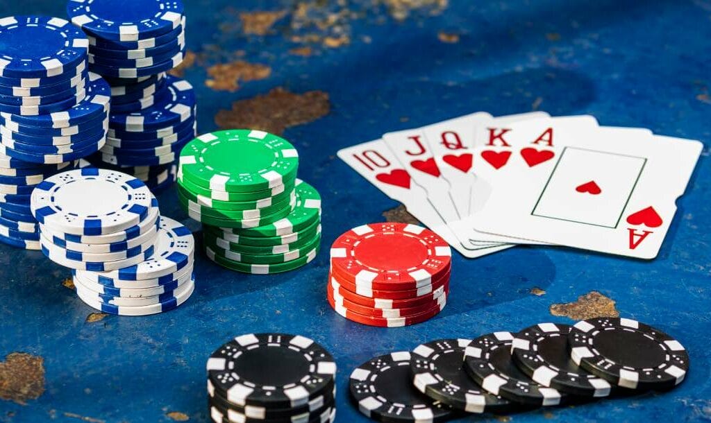 A stack of poker chips and playing cards.