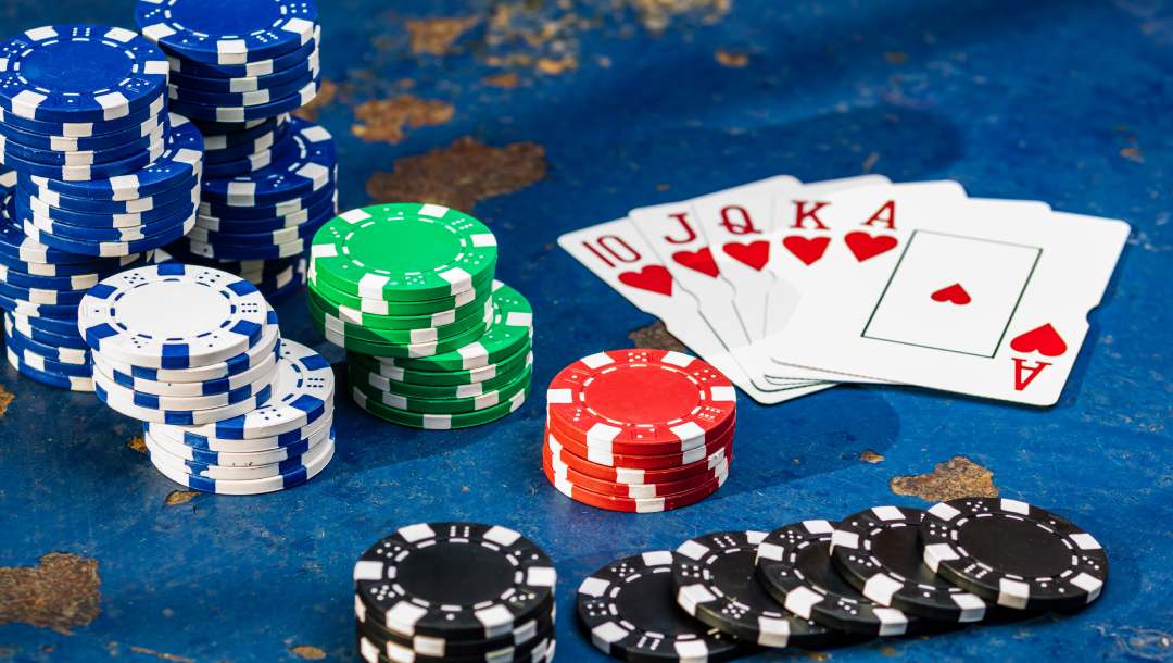A stack of poker chips and playing cards.