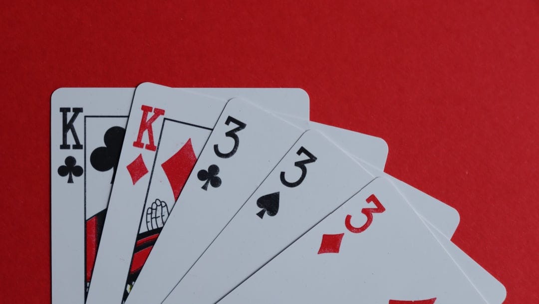 Poker cards featuring a full house.