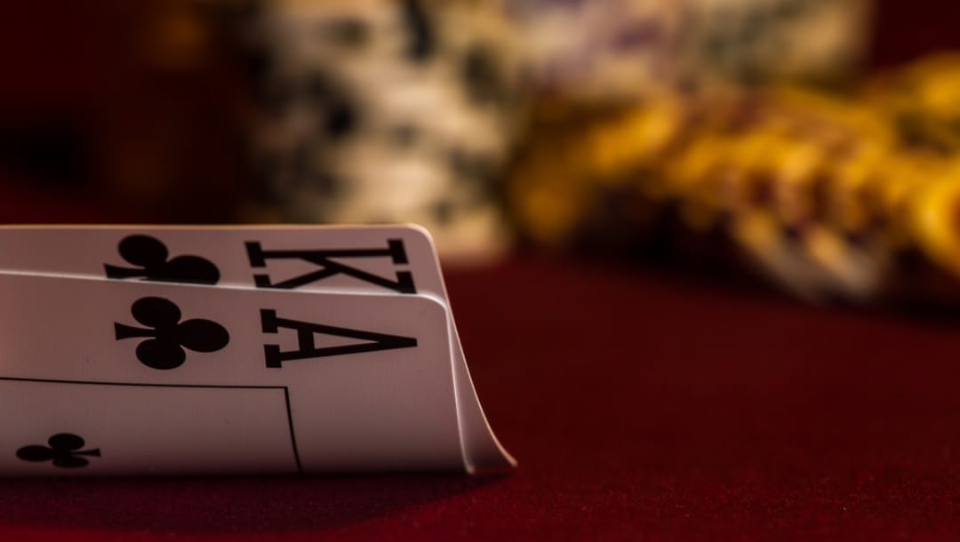 A king and ace card on the table.