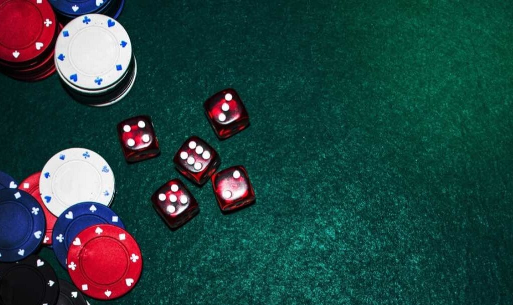 Aerial view of some dice and poker chips.