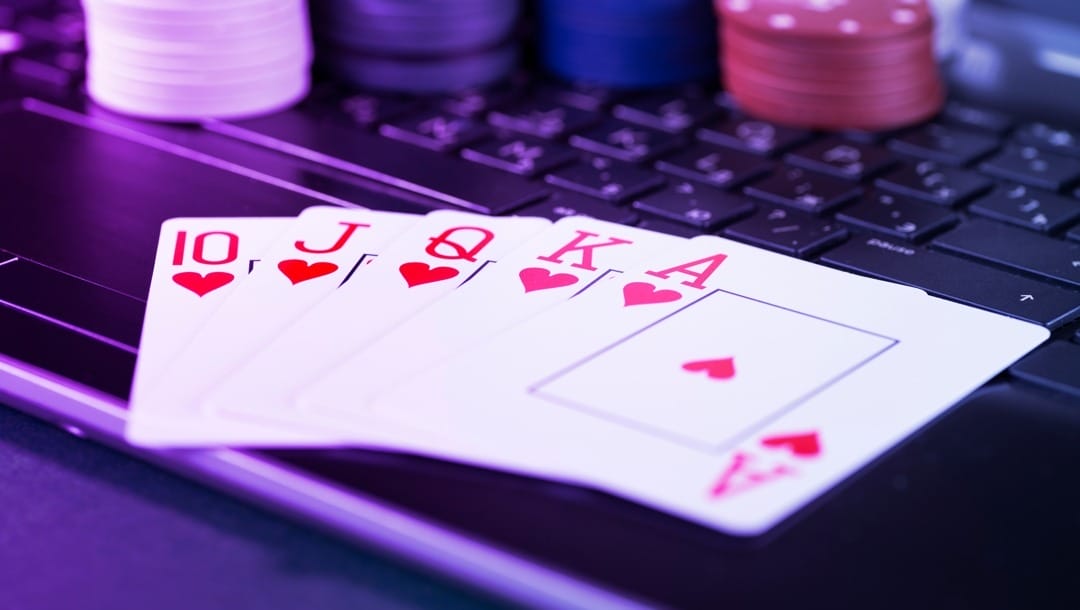 A royal flush on a laptop keyboard.