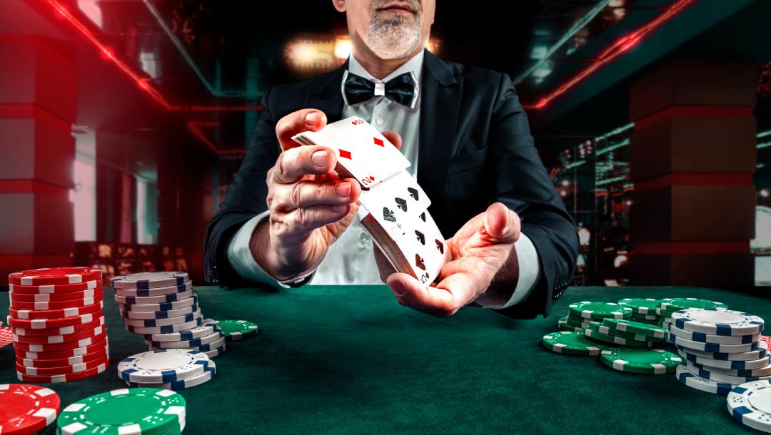 Croupier casino dealer with casino cards and chips.
