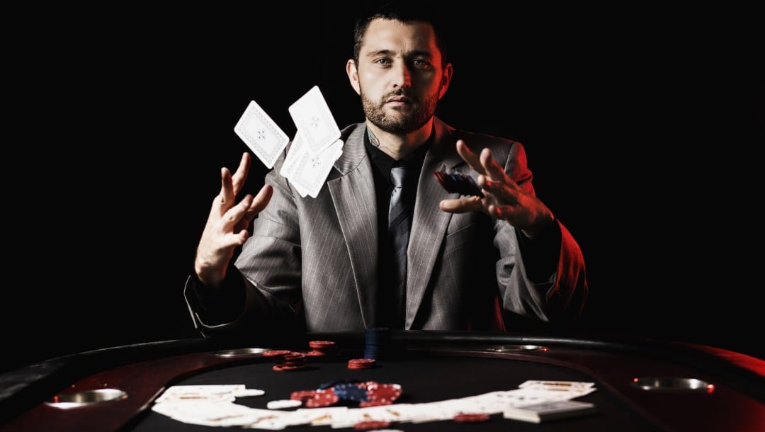 A poker player throwing playing cards.