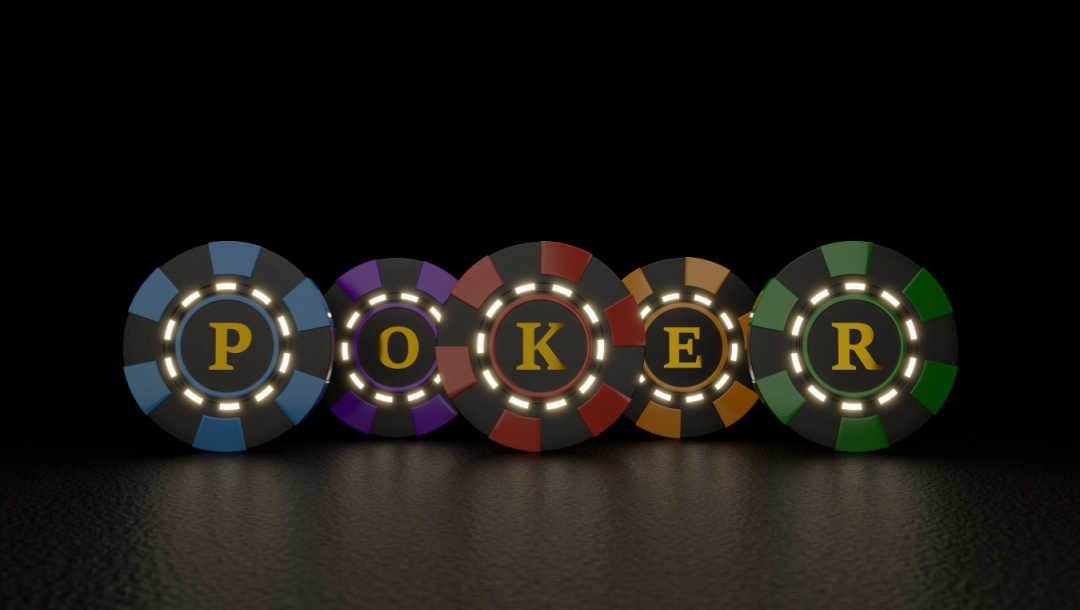 The word “poker” spelled out on poker chips against a black background.