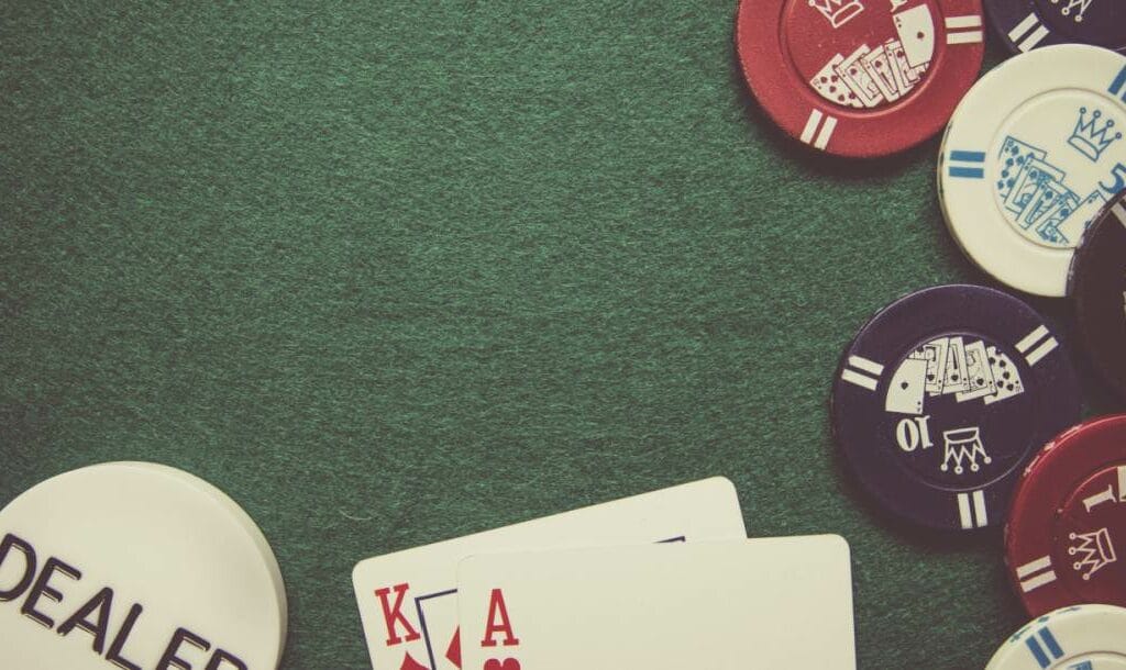 Playing cards and chips on a poker table.