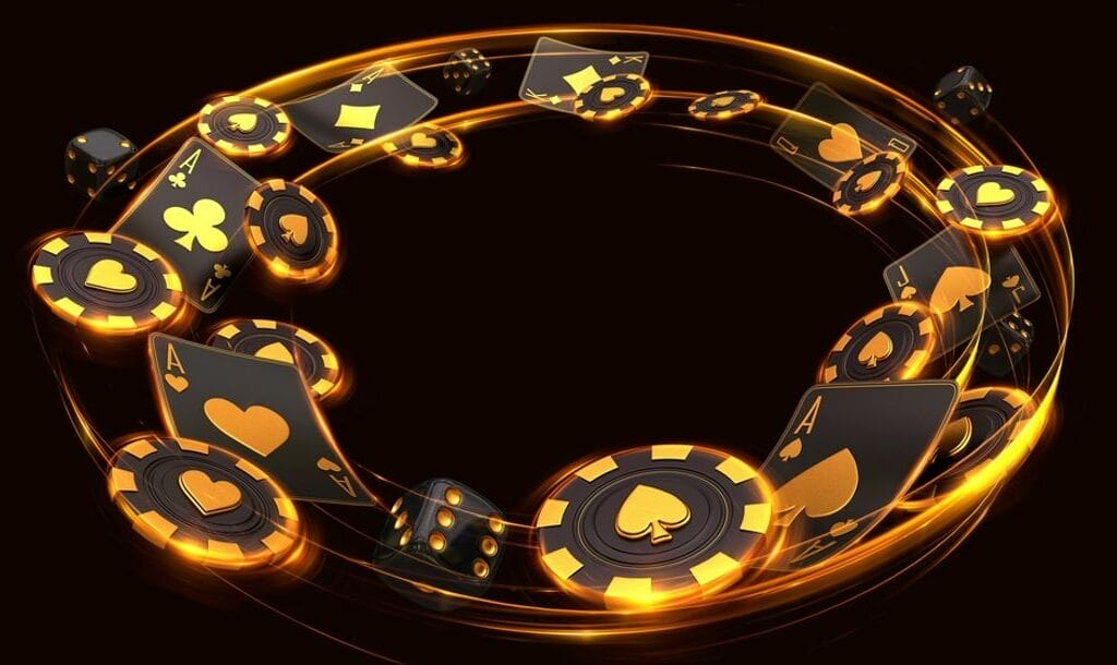 Swirling black and gold casino chips, cards and dice.