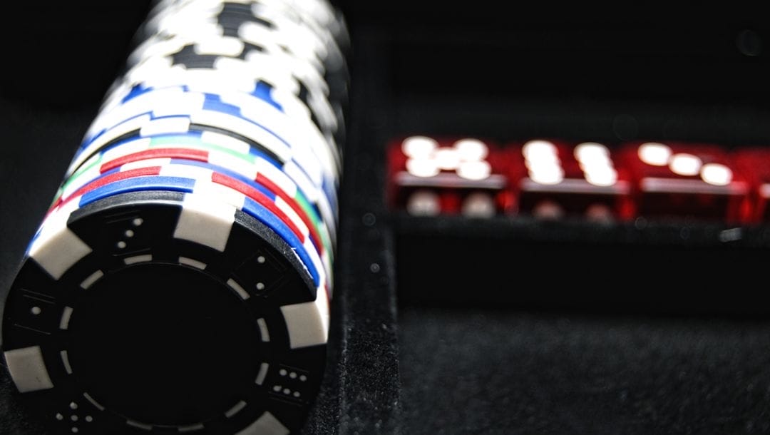 Casino chips neatly stacked on a poker table.