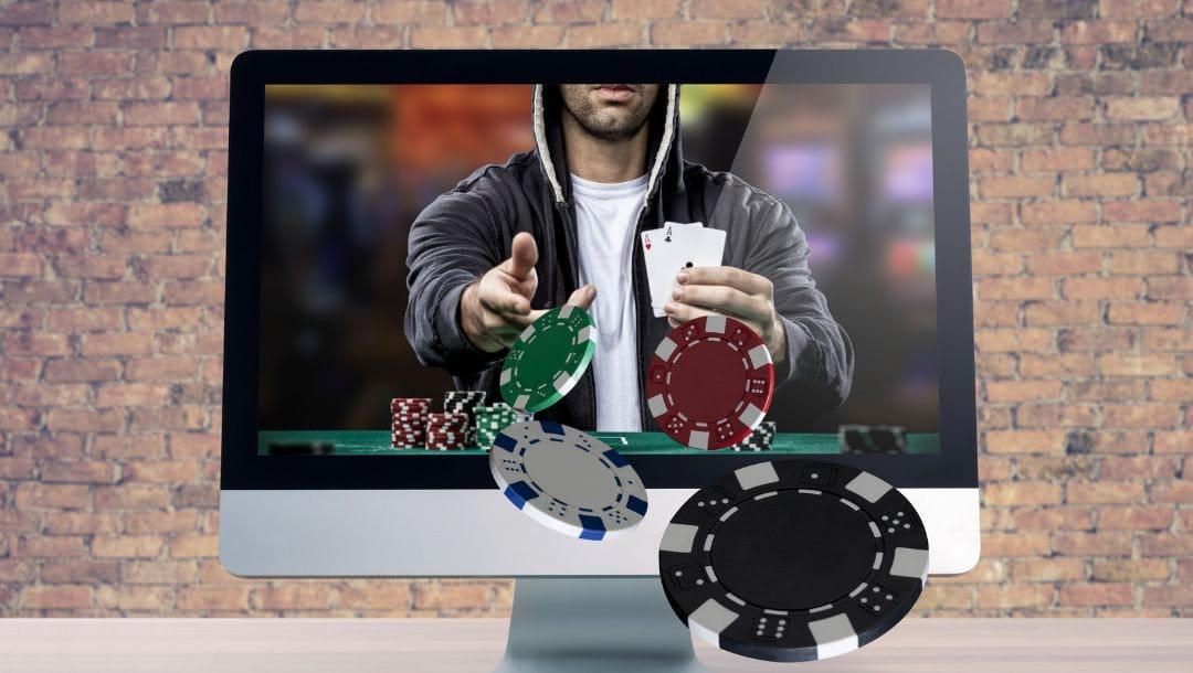 a computer screen on a white surface with a brick wall background, on the screen is a man who is holding up two ace playing cards and throwing poker chips forward through the screen in a 3D effect
