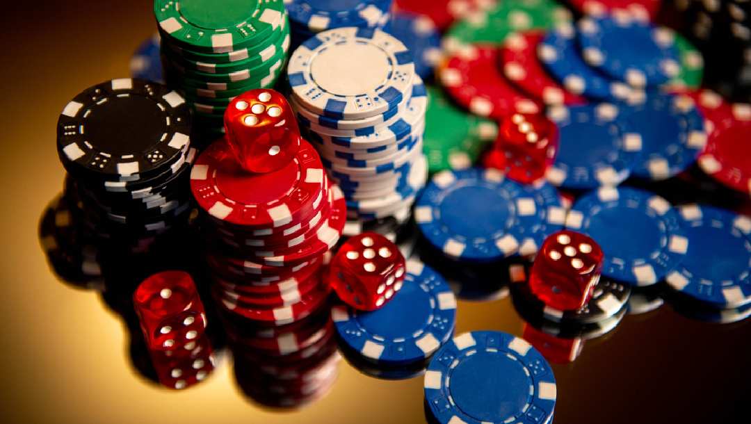 Dice on top of poker chips