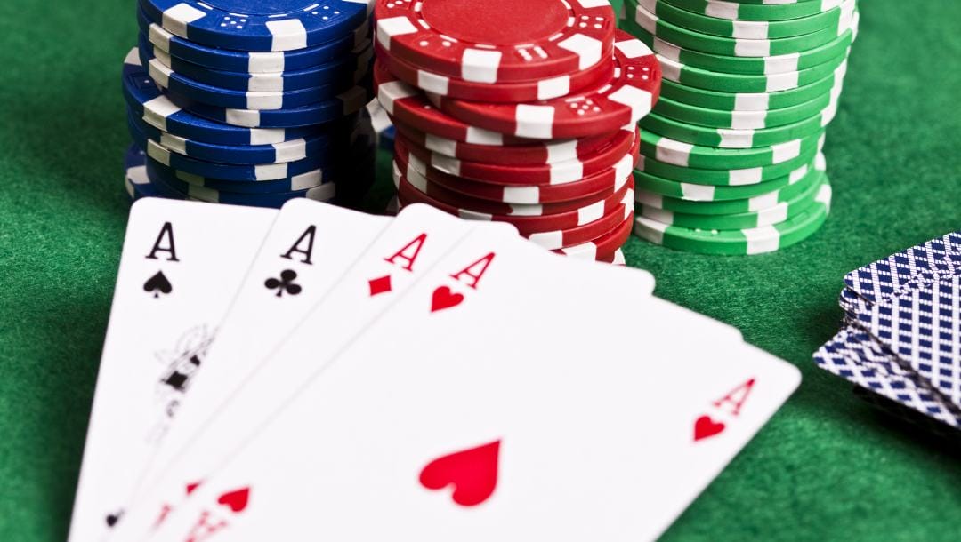 Ace playing cards and casino chips.