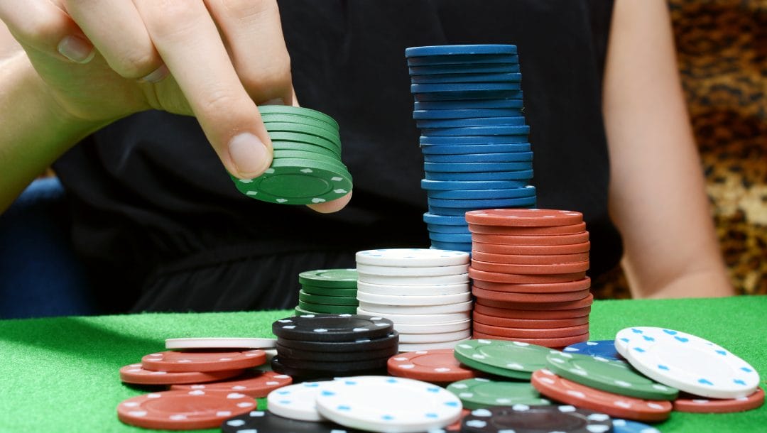 Poker chips on a green felt table.