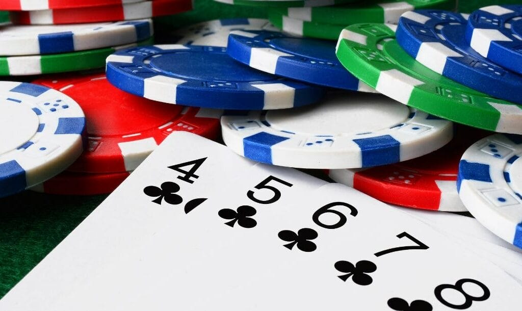 Cards and casino chips displayed on a poker table.